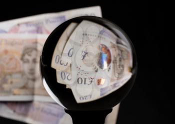 Crystal futures or fortune telling ball reflecting a british 10 pound sterling note as concept for the exchange rate for the currency