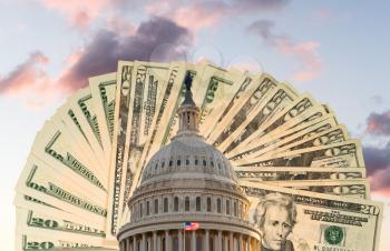 US flag flies in front of the US Capitol in Washington DC with cash behind the dome to illustrate coronavirus stimulus payment
