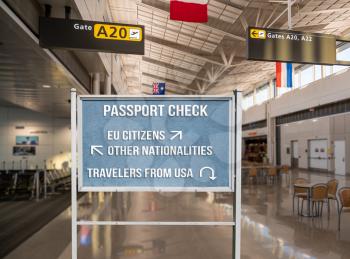 Concept of notice board telling travelers from USA to return home because of coronavirus travel ban into EU or European countries