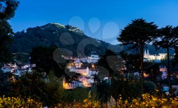 Dusk view of the Portuguese town of Sintra with the Moorish fortress on the hilltop above the city