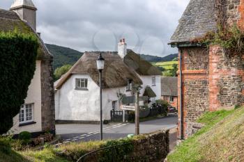 Path from churchyard to main street in the center of the pretty Devon village of Dunsford