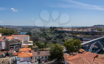 View over the roofs down to the Douro River from the top of the Cathedral tower in Oporto