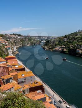 View over the roofs down to the Douro River from the train tracks on Ponte Luis in Oporto