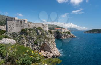 Panorama of the cliffside under Fort Lawrence and city walls of the old town in Dubrovnik