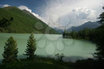 Beautiful mountain landscape near the lake. Mountain Lake. Kind of mountainous terrain and the water in the valley.