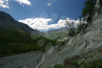 Mountain landscape. Highlands, the mountain peaks, gorges and valleys. The stones on the slopes.