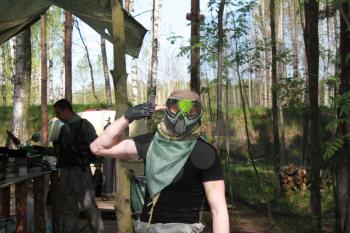 Russia, Volgodonsk - June 30, 2015: Paintball. Shooting competition of weapons with paint balls. Forest tournament