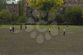 Football game. Training matches junior teams and fans.