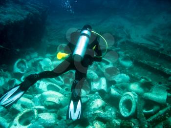 Sea off the coast of Phuket, Thailand - June 20, 2018: A scuba diver over a coral reef. Scuba diving
