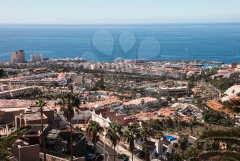 Costa Adeje, Tenerife, Spain - July 28, 2013: The islands of Tenerife is a resort for tourists. Coast of the sea and hotels on the beach.