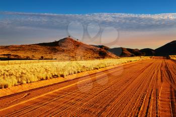 Road in Kalahari Desert at sunset, Namibia
