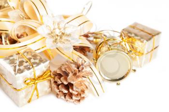 Golden Christmas decorations and gift on a white background