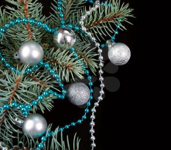 Black Christmas background with white decoration and fir branch 