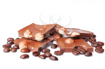 Chocolate with hazelnut and coffee beans on a white background