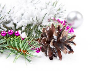 Christmas background with pine cone, bead  and fir branch 