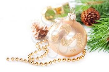 Christmas background with golden decorations and pine branch