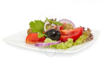 fresh vegetable salad with tomatoes and olives on white background