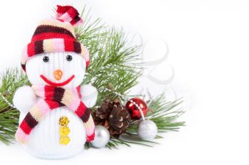 Christmas background with snowman,decorations and pine branch