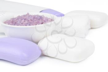 Soap, towels and aromatic salt on a white background