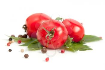 fresh red tomatoes,basil and pepper on white background