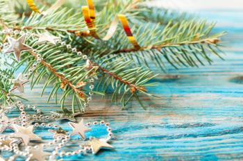 Christmas background with silver decorations and fir branch