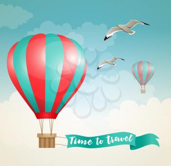 Travel background with air balloon and birds flying in the sky 