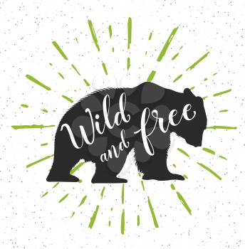 Silhouette of a wild bear and calligraphy. Wild and free lettering.