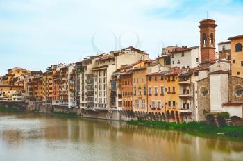 Old houses on the Arno River and Ponte Vecchio in Florence, Italy 