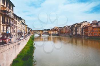 View of the Arno river, Bridge Ponte Vecchio and street. Florence, Italy.