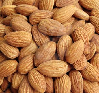 Peeled almonds closeup background