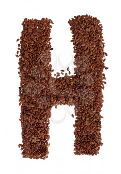 Letter H made with Linseed also known as flaxseed isolated on white background. Clipping Path included