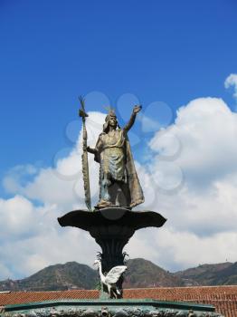 Statue of the Inca Pachacutec over the fountain at the Plaza de Armas in Cuzco, Peru