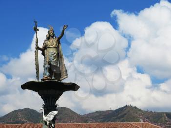 Statue of the Inca Pachacutec over the fountain at the Plaza de Armas in Cuzco, Peru