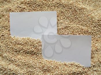 White paper on raw cous cous semolina background