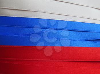 Russia flag or banner made with red, blue and white ribbons