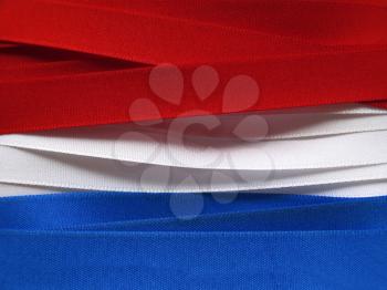 Luxembourg or Paraguay flag or banner made with red, blue and white ribbons