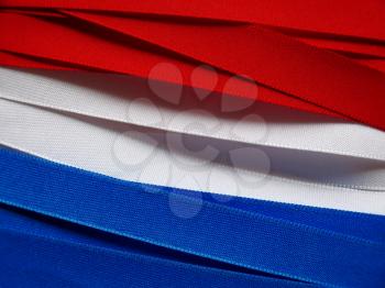 Luxembourg or Paraguay flag or banner made with red, blue and white ribbons