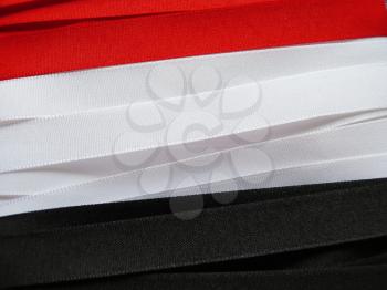 Iraq flag or banner made with red, white and black ribbons
