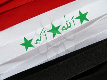 Iraq flag or banner made with red, white and black ribbons