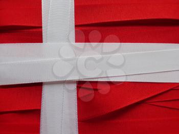 Denmark flag or banner made with red and white ribbons