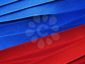 Shiny blue and red satin ribbon background
