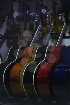 guitar music store with racks and various classical guitar