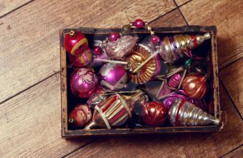 Old rough hewn wooden box with folded Vintage Christmas Toys