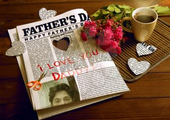 Conceptual still life on Father's Day. Loving dad child cut out of my father's paper hearts, she made the sign and made coffee.