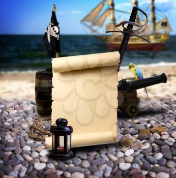 Pirate ambiance with with scroll and space for text, cannon, treasure, lantern, and parrot on the bank of an empty pebble beach. In the background is pirate schooner.