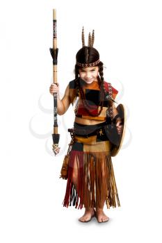 A little girl dressed as an Indian warrior armed with a spear and shield