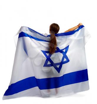 a small Jewish girl stands with her back to the spectator and holds in her hands a large flag of Israel with the star of David.
