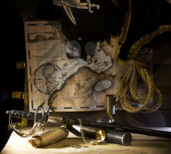 Pirate accessories and weapons laid out near the treasure map