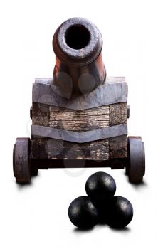 An ancient sea cannon on a wooden lafite stands with a barrel directed towards the viewer