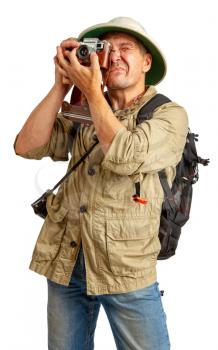 traveler in a cork helmet and khaki clothes photographs something on the camera